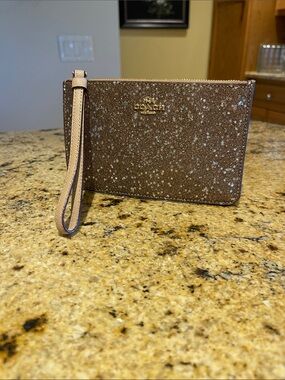 Coach Brown Glitter Star Wristlet with Gold Logo